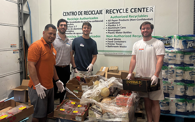 Sunflower Bank interns volunteering at The Stewpot moving food
