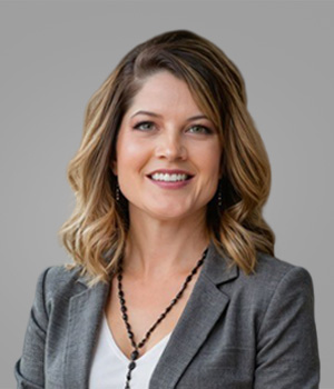Christne Munoz Headshot on gray background