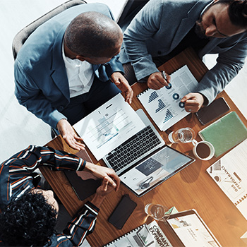 group of employees at table working