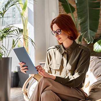 woman looking at tablet