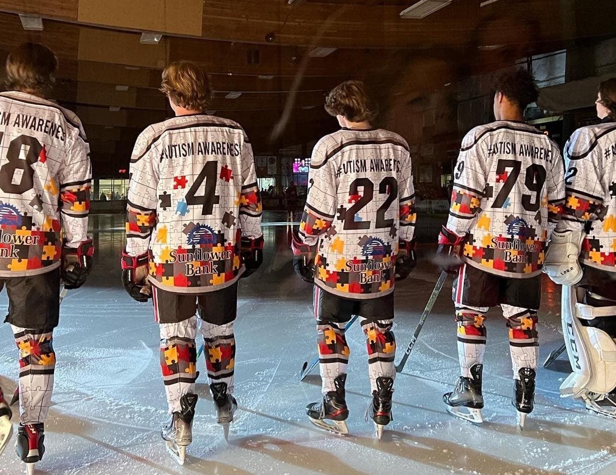 Pueblo Bull's hockey players standing on ice
