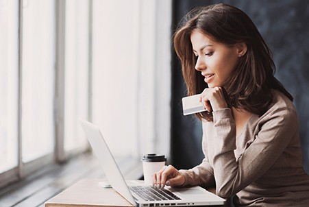 woman looking at laptop
