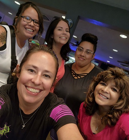 group of women taking a selfie at event