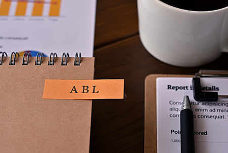 ABL sticky note with coffee and paper