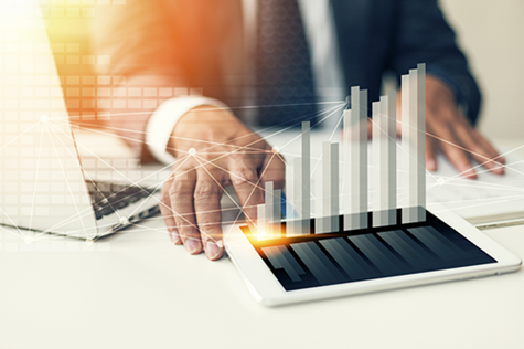 man in suit looking at chart