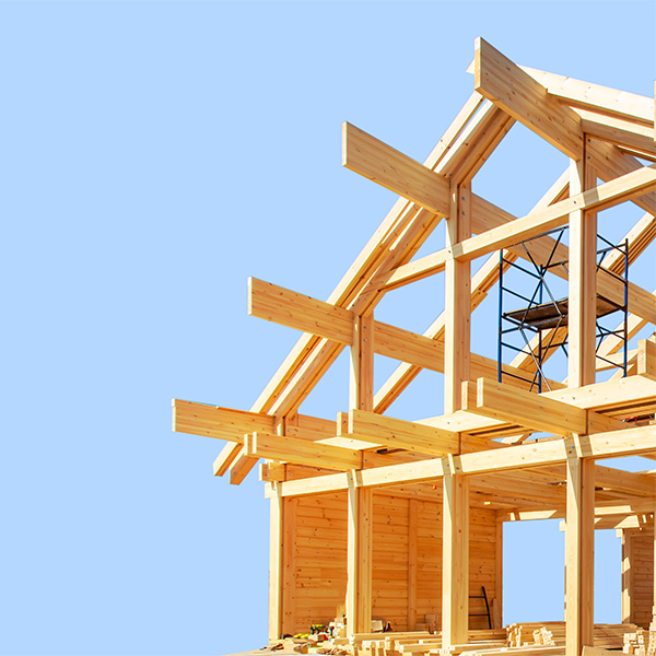 house being built against blue sky background