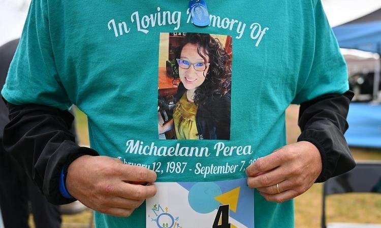 person's torso wearing a memorial shirt