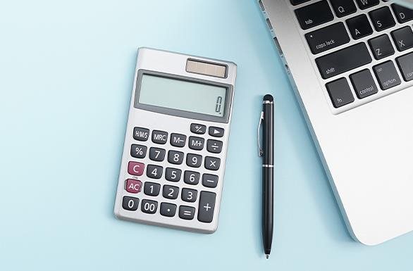 Calculator pen and laptop