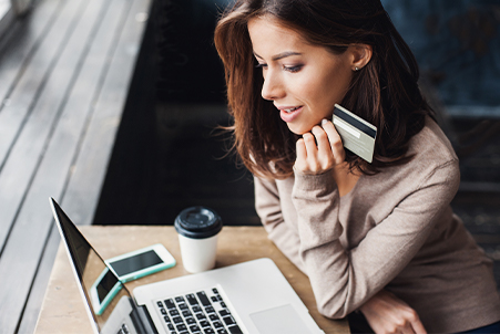 Woman looking at laptop