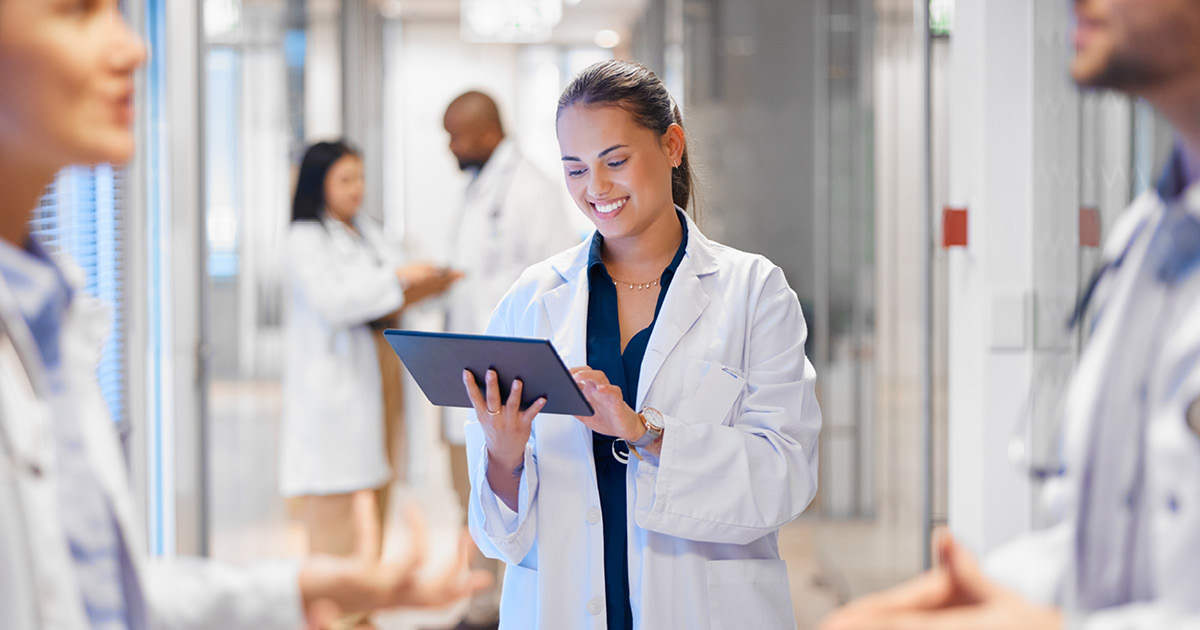 people wearing medical lab coats working