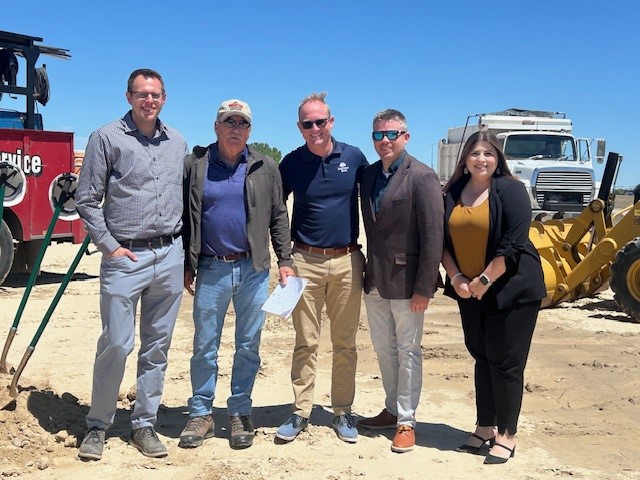 group of 5 bankers at constructino site