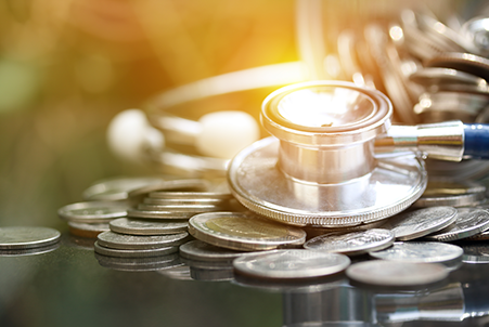 coins under a stethoscope