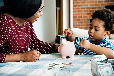 mom with child and piggybank