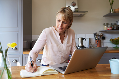 woman on computer writing
