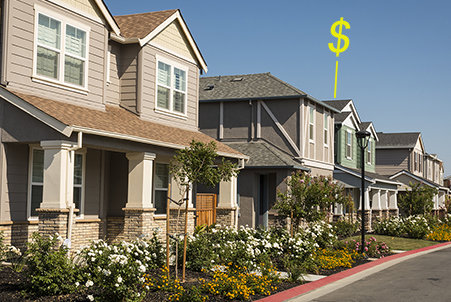 two houses with money sign