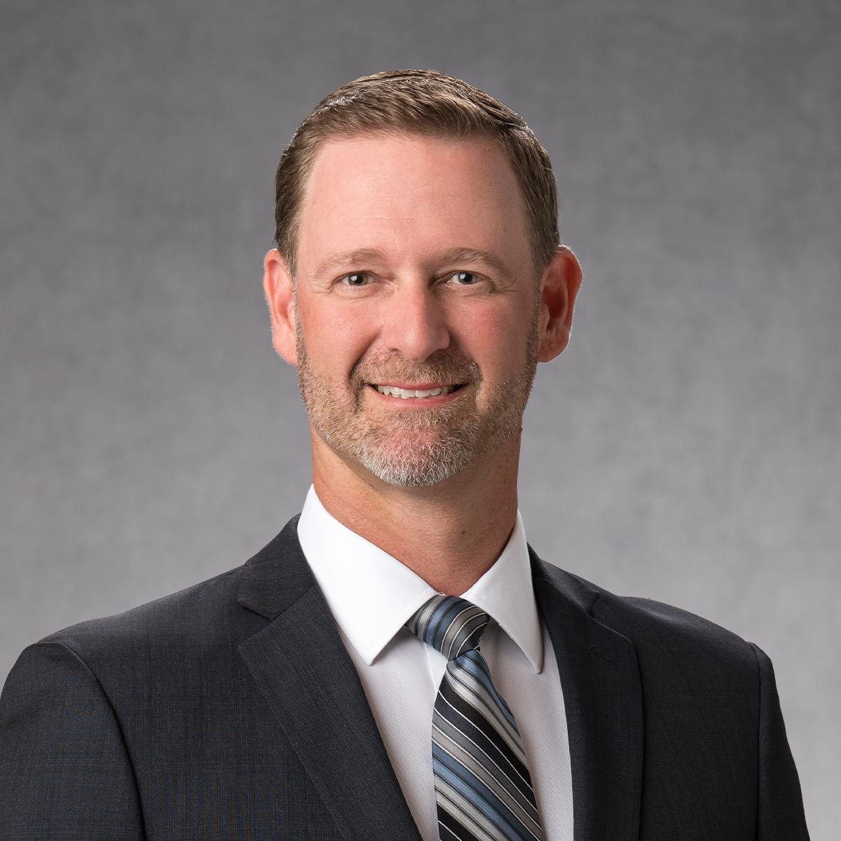 Headshot of Rich Berman in suit and tie