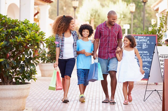 happy family walking down road